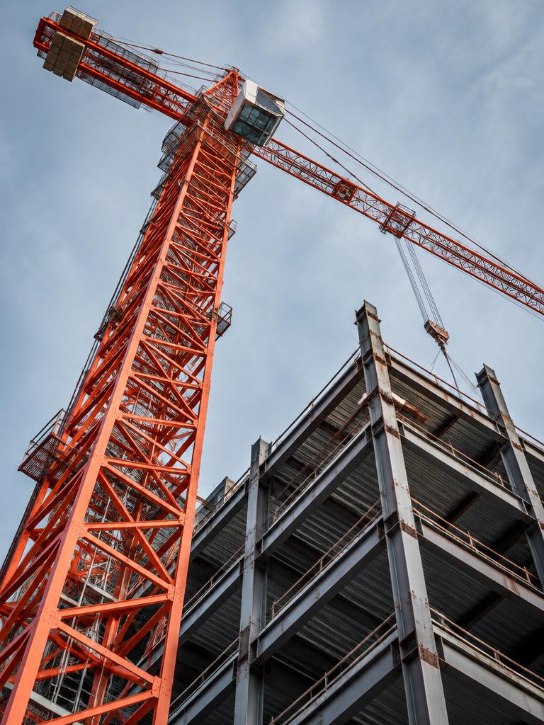 Tower crane above a steel building frame